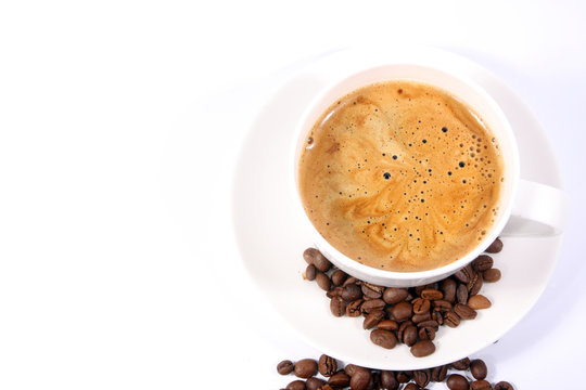 Cup of coffee with beans