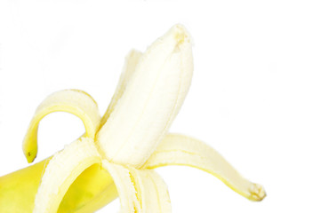 Obraz premium A single peeled fresh banana isolated on white background