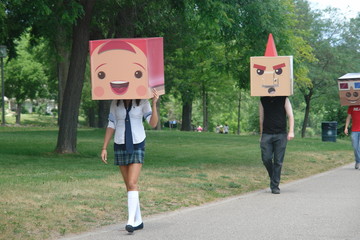 Box People  walking parading through park