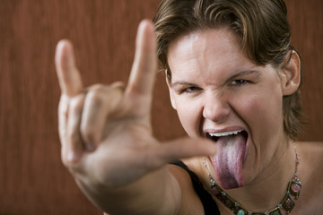 Pretty Woman Making Bull Horns