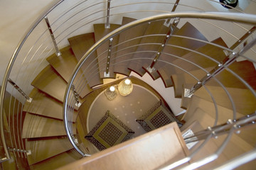 spiral staircase with two lamps