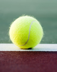 Tennis ball on baseline