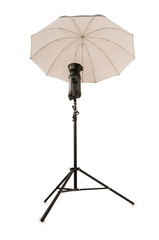 Studio strobe with umbrella isolated on the white