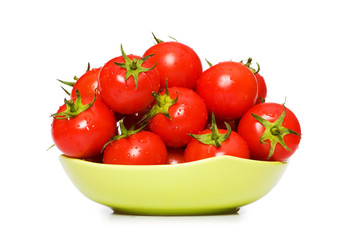 Wet whole tomatos arranged isolated on white