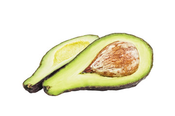An avocado cut in two pieces, white background.