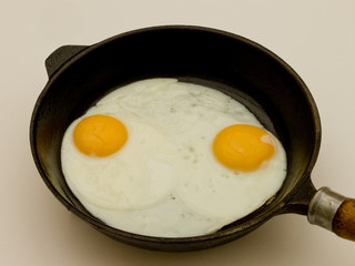 Two eggs in pan.