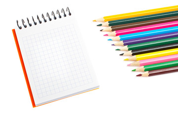 Fototapeta na wymiar Blank notebook and coloured pencils