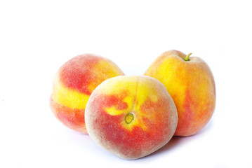 Fototapeta na wymiar three peaches