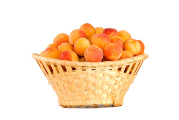 Wicker basket filled with apricots