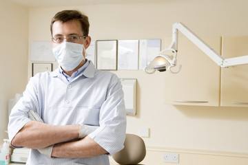 Fototapeta na wymiar Dentist wearing mask in exam room