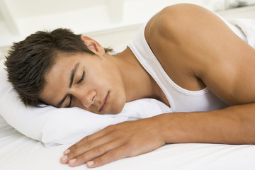 Obraz na płótnie Canvas Man in bed sleeping