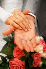 Obraz na płótnie Canvas Hands of newly-married
