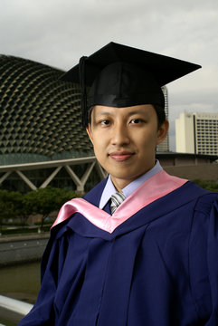 Asian graduate outdoors in Singapore