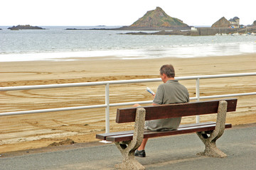 reading man at the beach