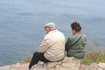 old couple watching the sea