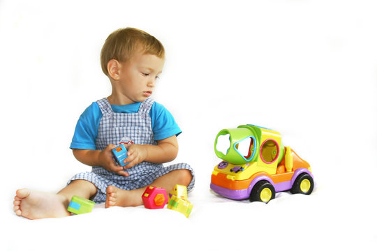 baby boy playing with toy-truck
