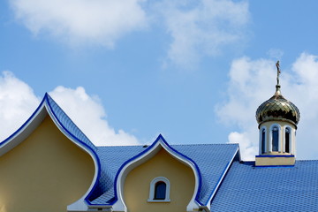 blue roof of church against the sky background