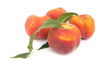 Peaches four perfect with leaves