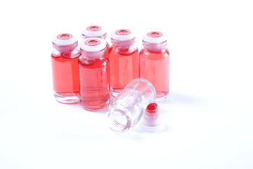 Red serum bottles