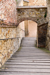 Fototapeta na wymiar old stone stairs in the shadow