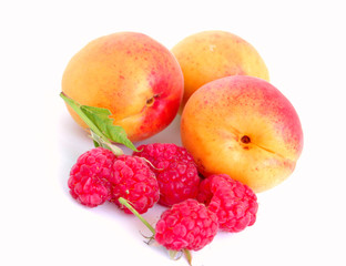 close-up of raspberry and apricots