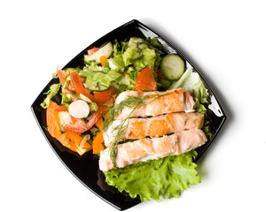 Stake from a salmon with vegetables