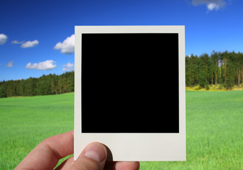 hand holding blank photo