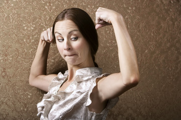 Young Woman Admiring Her Bicep