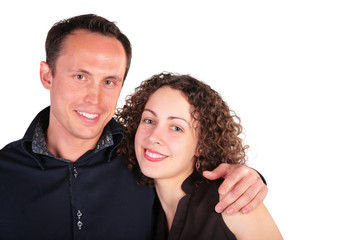 young pair embraces and smiles