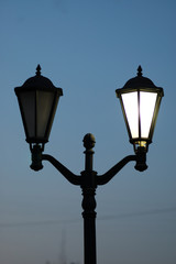 Fototapeta na wymiar classic old-fashioned lamps on a lamppost