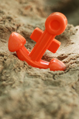 toy anchor in sand