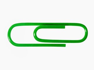 Green paper clip isolated