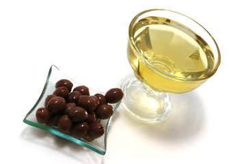 gold olive oil with brown olives