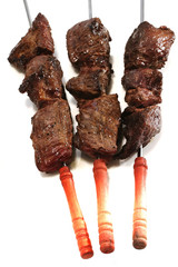meat on skewer with tomatoes