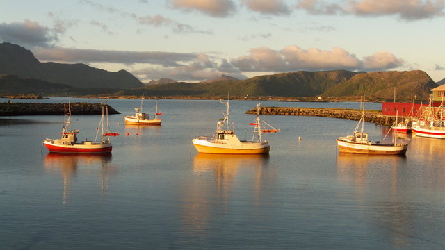 three fishing boats in Eggum at  midnight