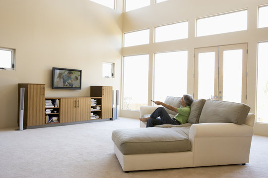 Man In Living Room Watching Television