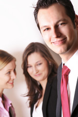 Fototapeta na wymiar successful business man in front of two business women