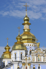 Fototapeta na wymiar Golden towers of Orthodox church in Kiev, Ukraine