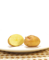 Potato on a plate isolated