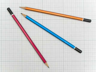 Three pencils at the plotting paper