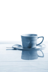 Coffee cup floating on waves