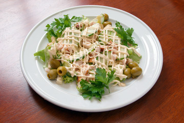 The Italian salad with olives and a liver