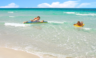 Fototapeta na wymiar Family Playing in Ocean Surf