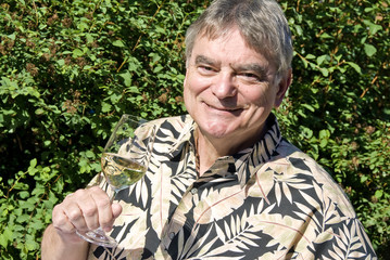 Man Holding a Glass of White Wine