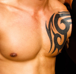 Male torso with tattoo