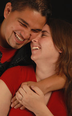 laughing attractive spanish and caucasian ethnic mix couple