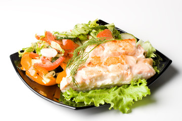 Stake from a salmon with vegetables