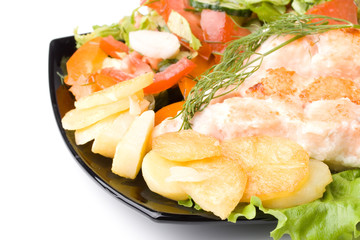 Stake from a salmon with vegetables