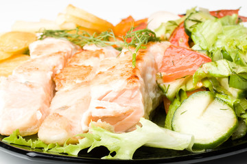 Stake from a salmon with vegetables