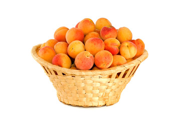 Wicker basket filled with apricots